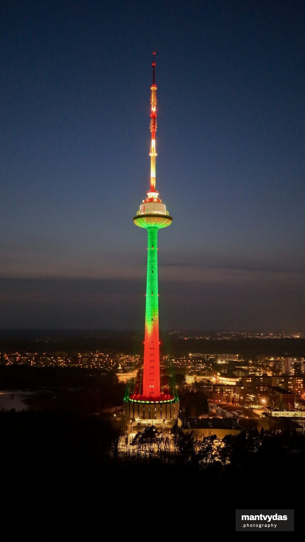 Vilnius TV Tower in national colours, spring blue hour