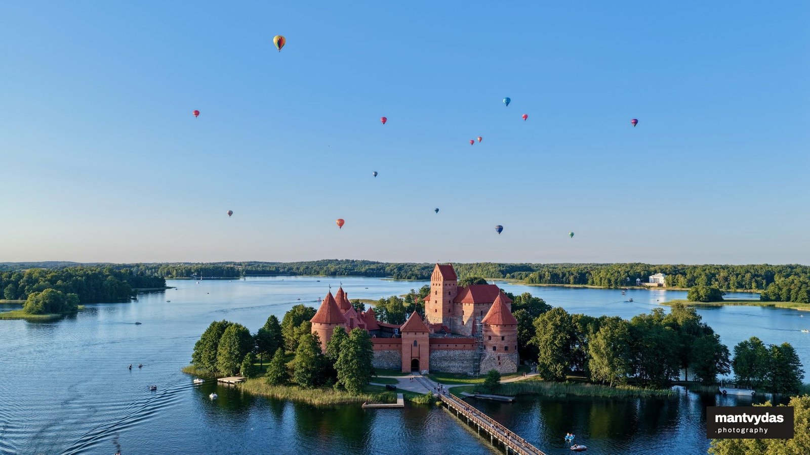 Balloons over Trakai Island Castle, summer evening