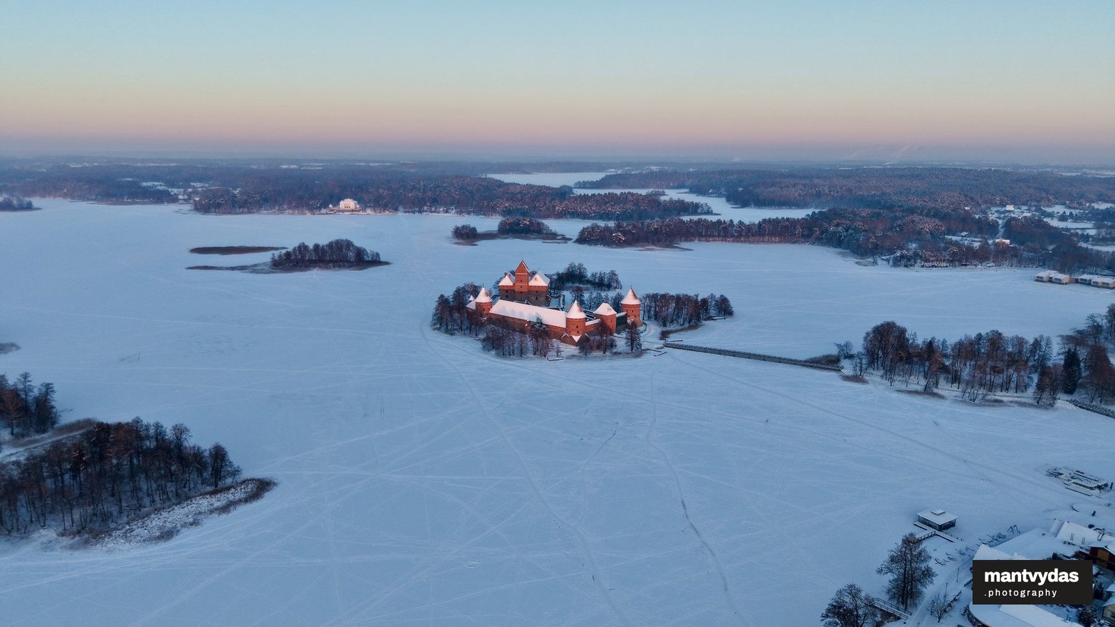Trakai Island Castle on frozen Lake Galvė, winter
