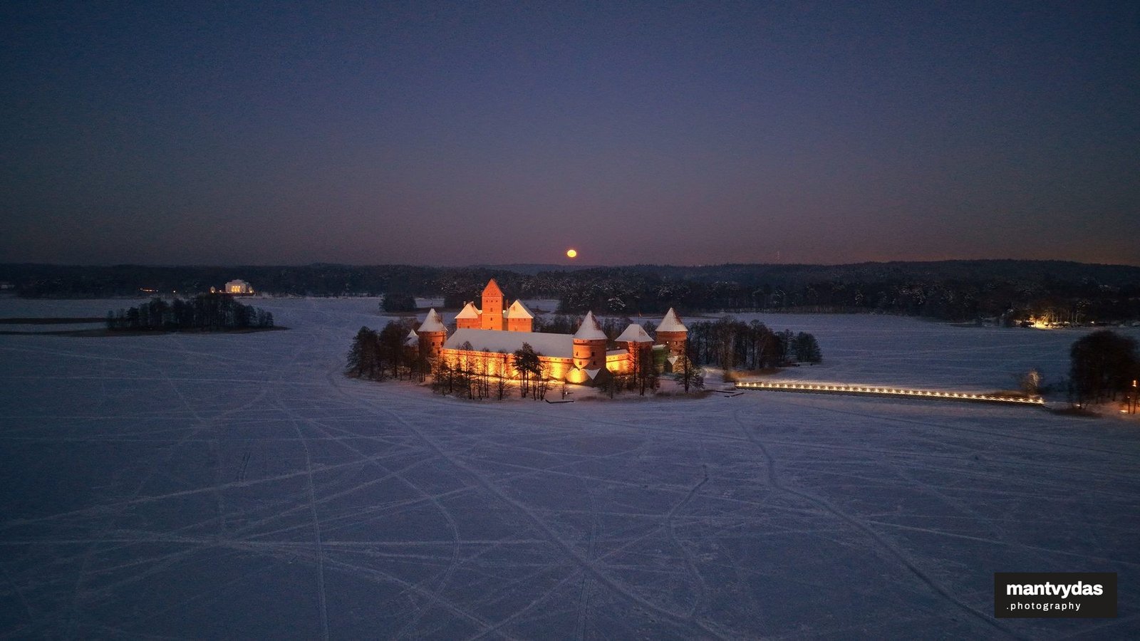 Trakai Island Castle illuminated, winter blue hour