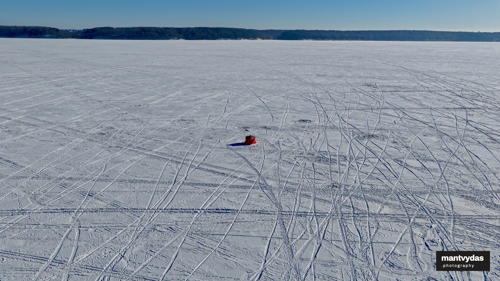 Kite skiing on the frozen Kaunas Reservoir, winter
