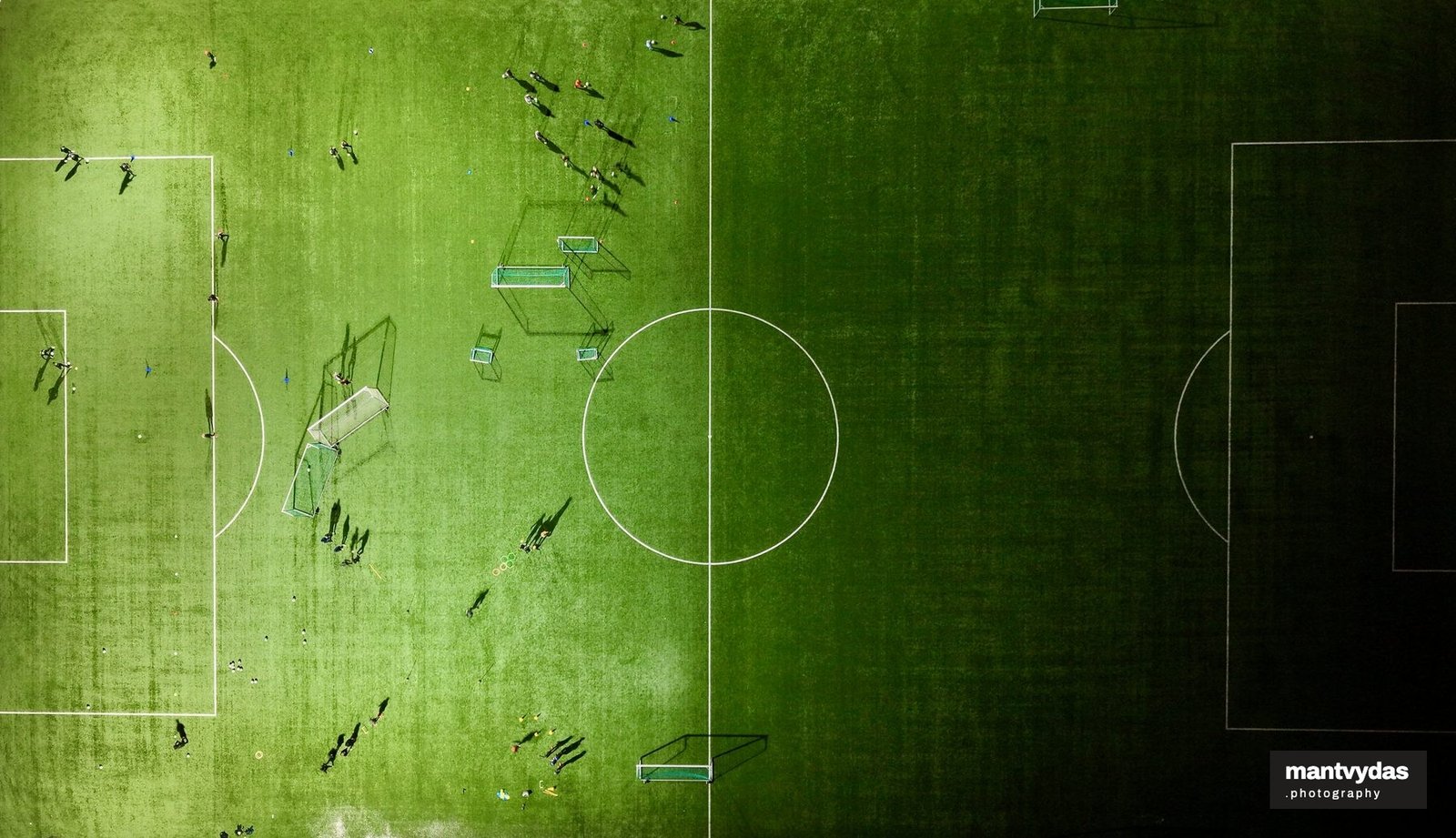 Floodlit football pitch, Vilnius, spring blue hour